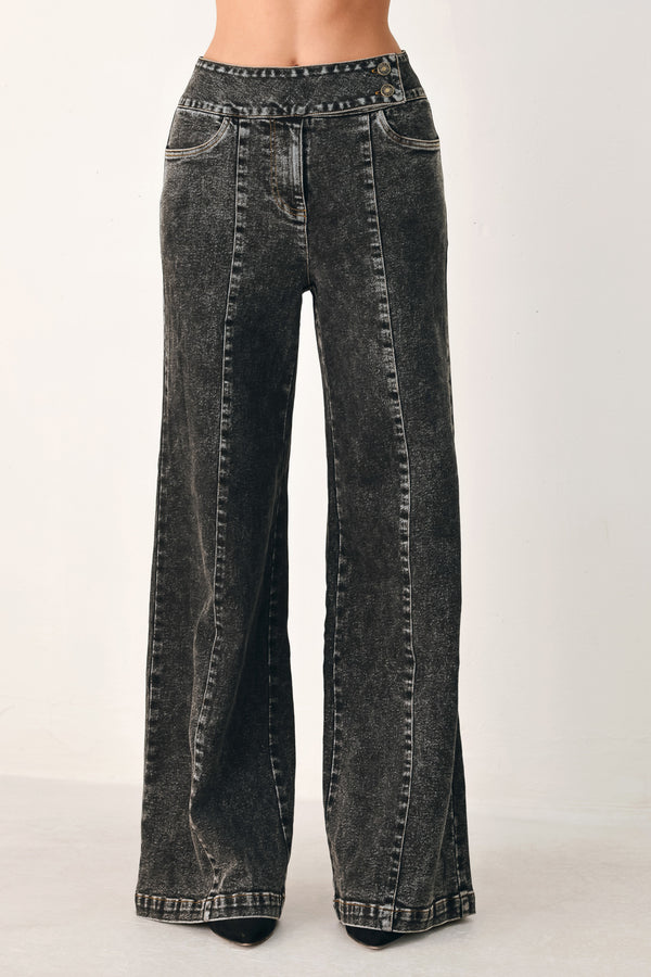 Wide-leg black acid-wash denim jeans with a high waist and studded belt loops, shown on a model | FREEMARKET