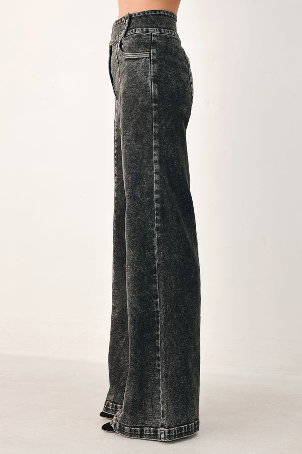 Wide-leg black acid-wash denim jeans with a high waist and studded belt loops, shown on a model | FREEMARKET
