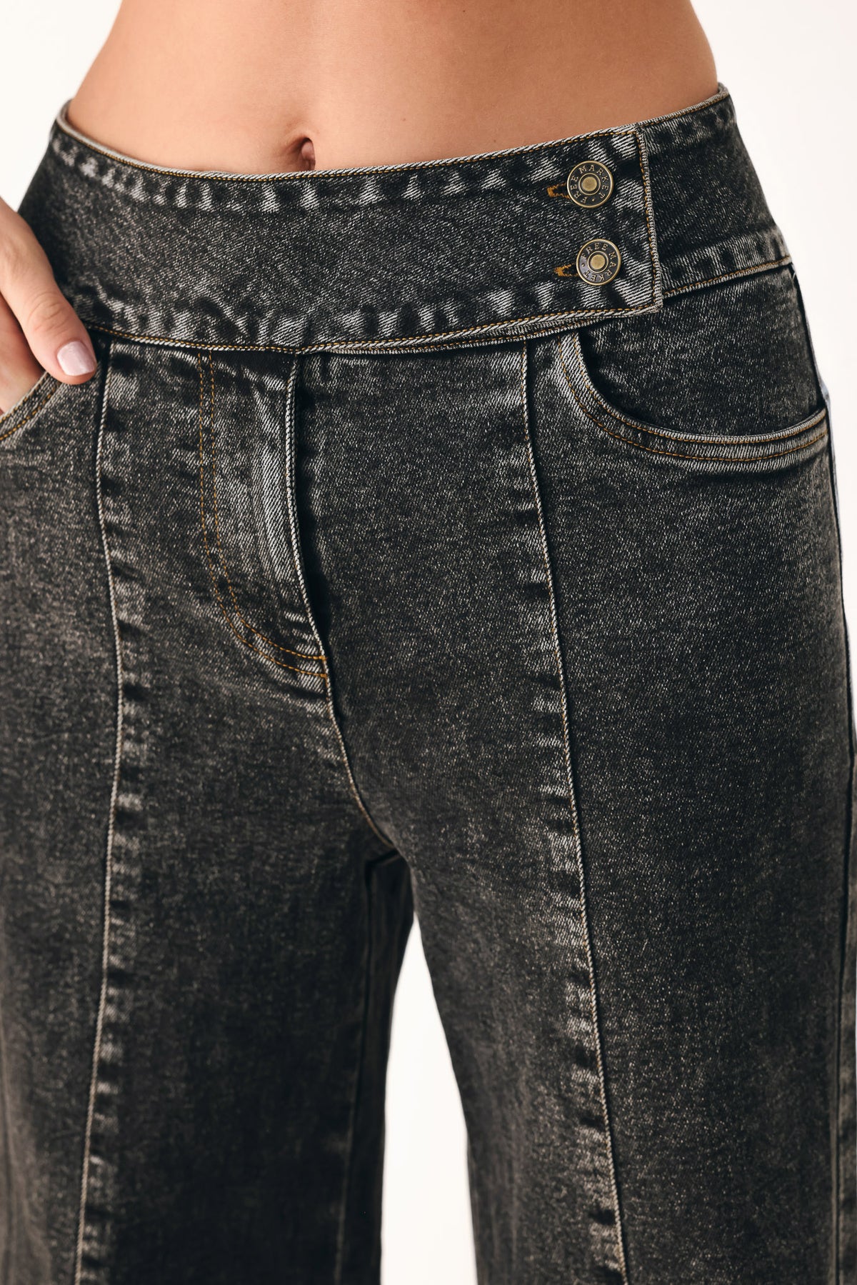 Wide-leg black acid-wash denim jeans with a high waist and studded belt loops, shown on a model | FREEMARKET