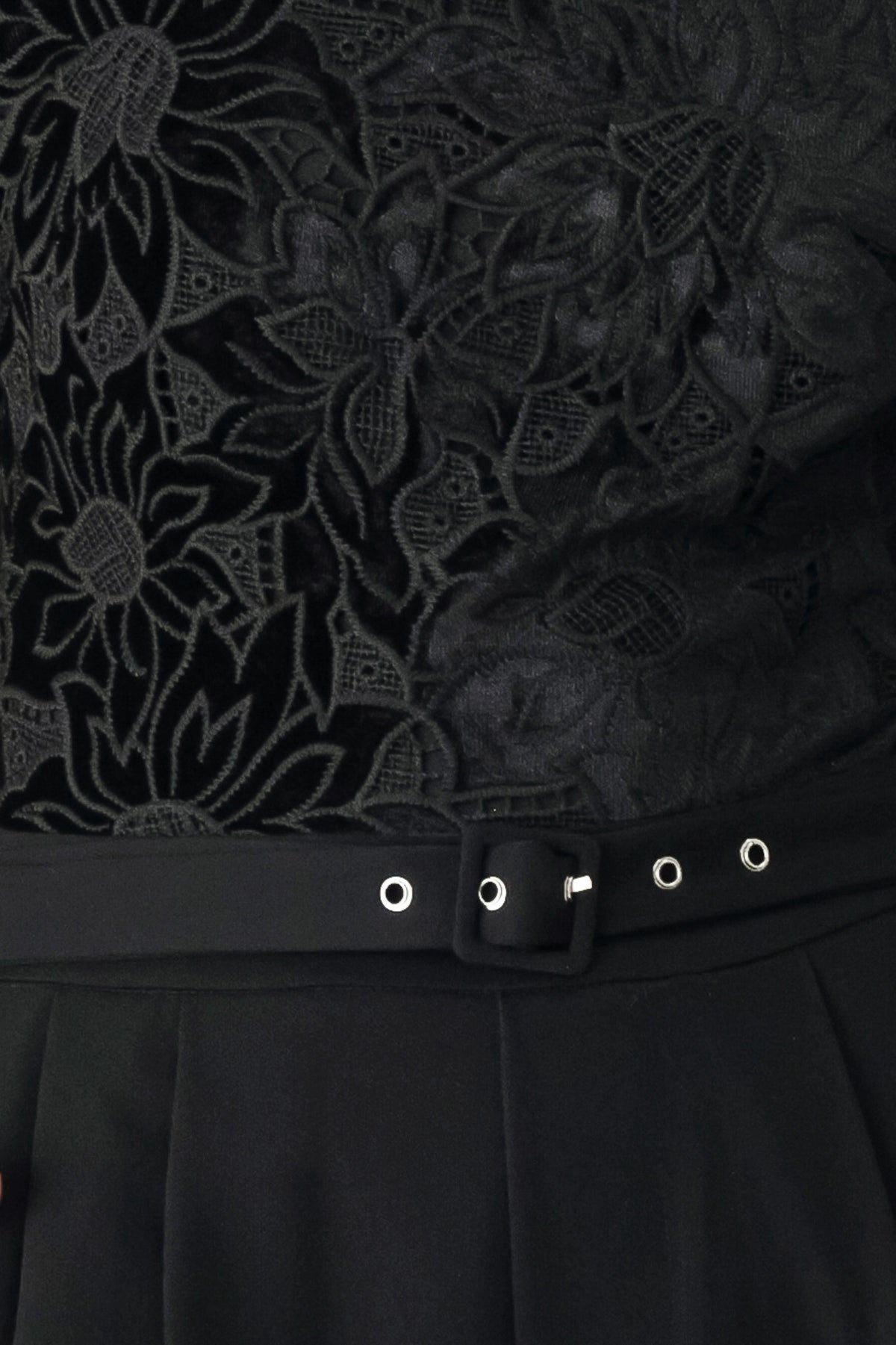 A woman modeling a black long-sleeve jumpsuit with a lace bodice and wide-leg trousers | FREEMARKET