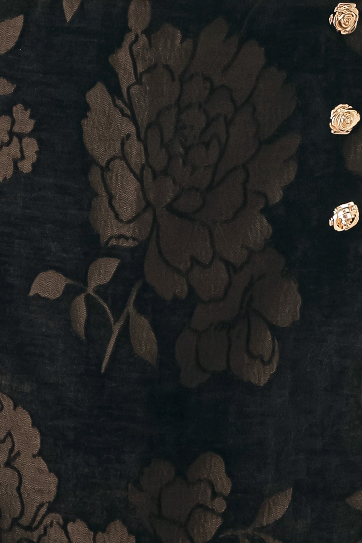 Woman wearing a dark brown mini skort with a brown floral jacquard pattern | FREEMARKET