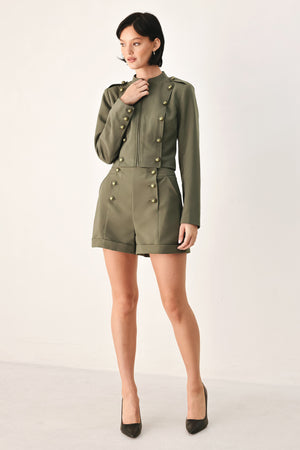Olive green double-breasted shorts with gold-tone buttons, modeled by a woman | FREEMARKET