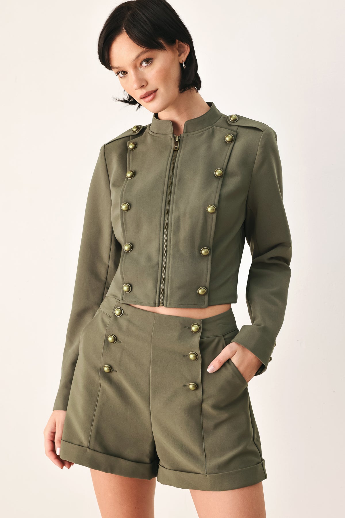 Olive green double-breasted shorts with gold-tone buttons, modeled by a woman | FREEMARKET