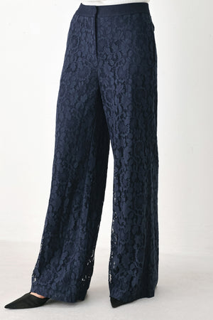 A model wearing dark navy lace wide-leg pants | FREEMARKET