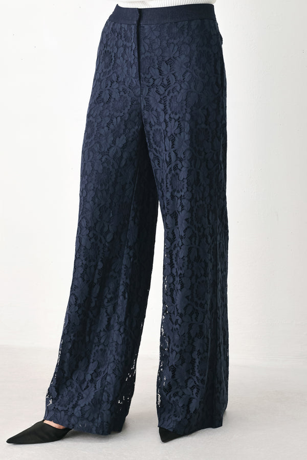 A model wearing dark navy lace wide-leg pants | FREEMARKET