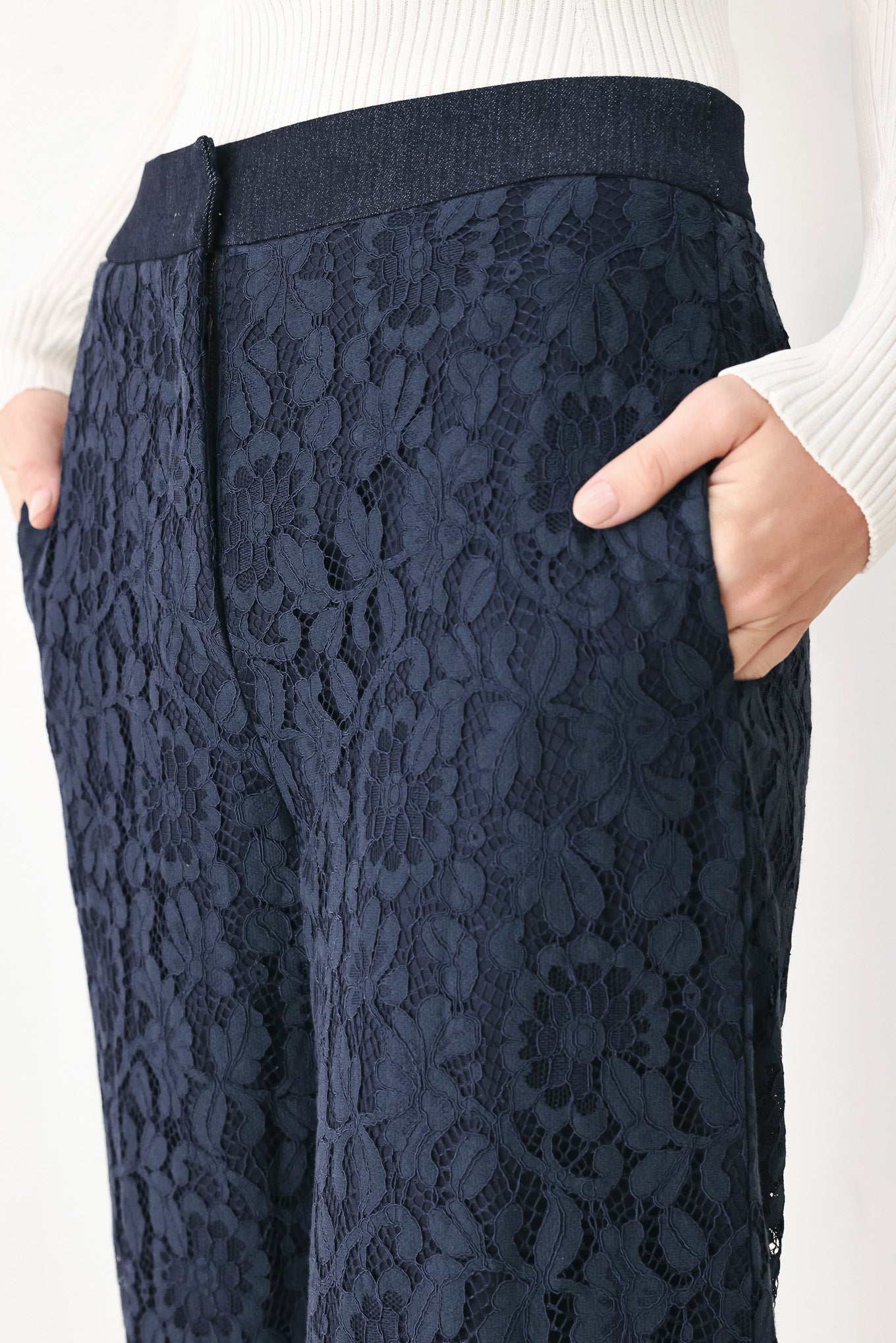 A model wearing dark navy lace wide-leg pants | FREEMARKET