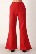 Red wide-leg cropped pants with rolled cuffs, shown on a model | FREEMARKET