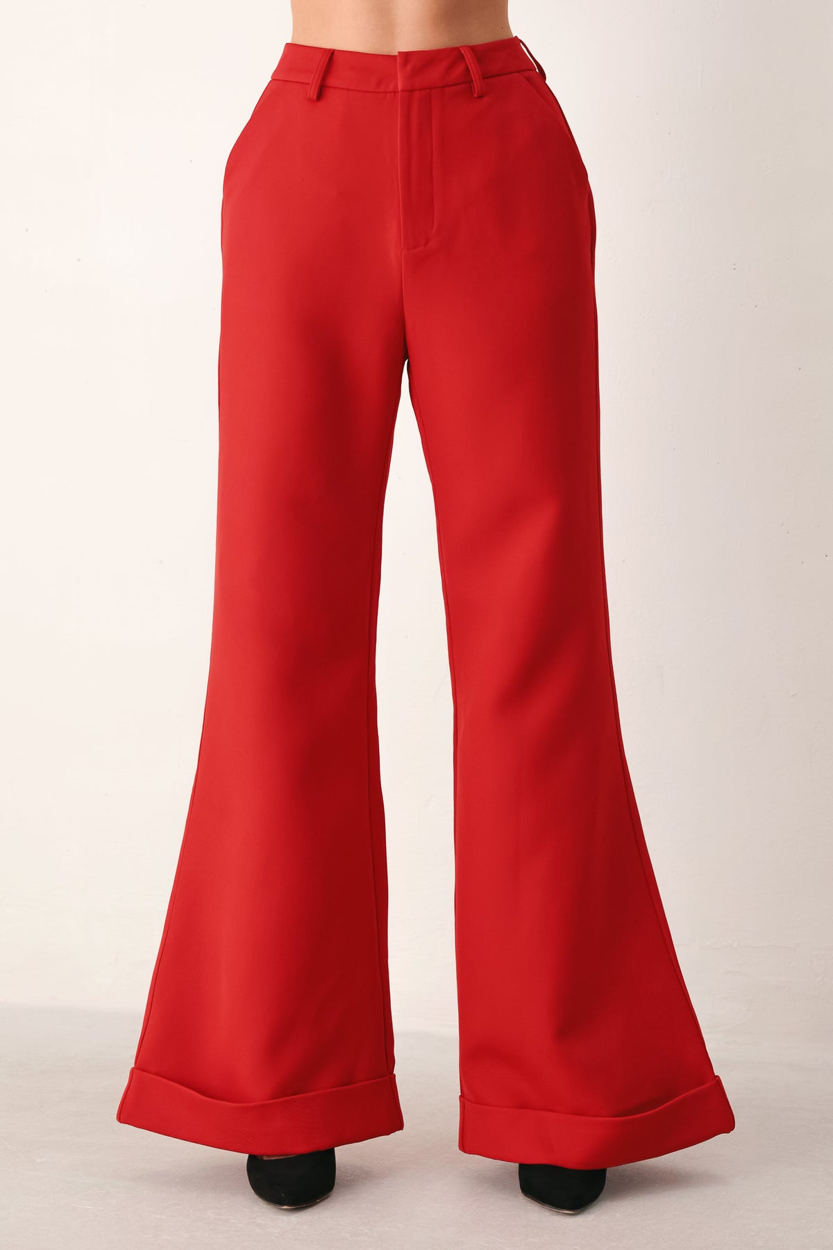 Red wide-leg cropped pants with rolled cuffs, shown on a model | FREEMARKET