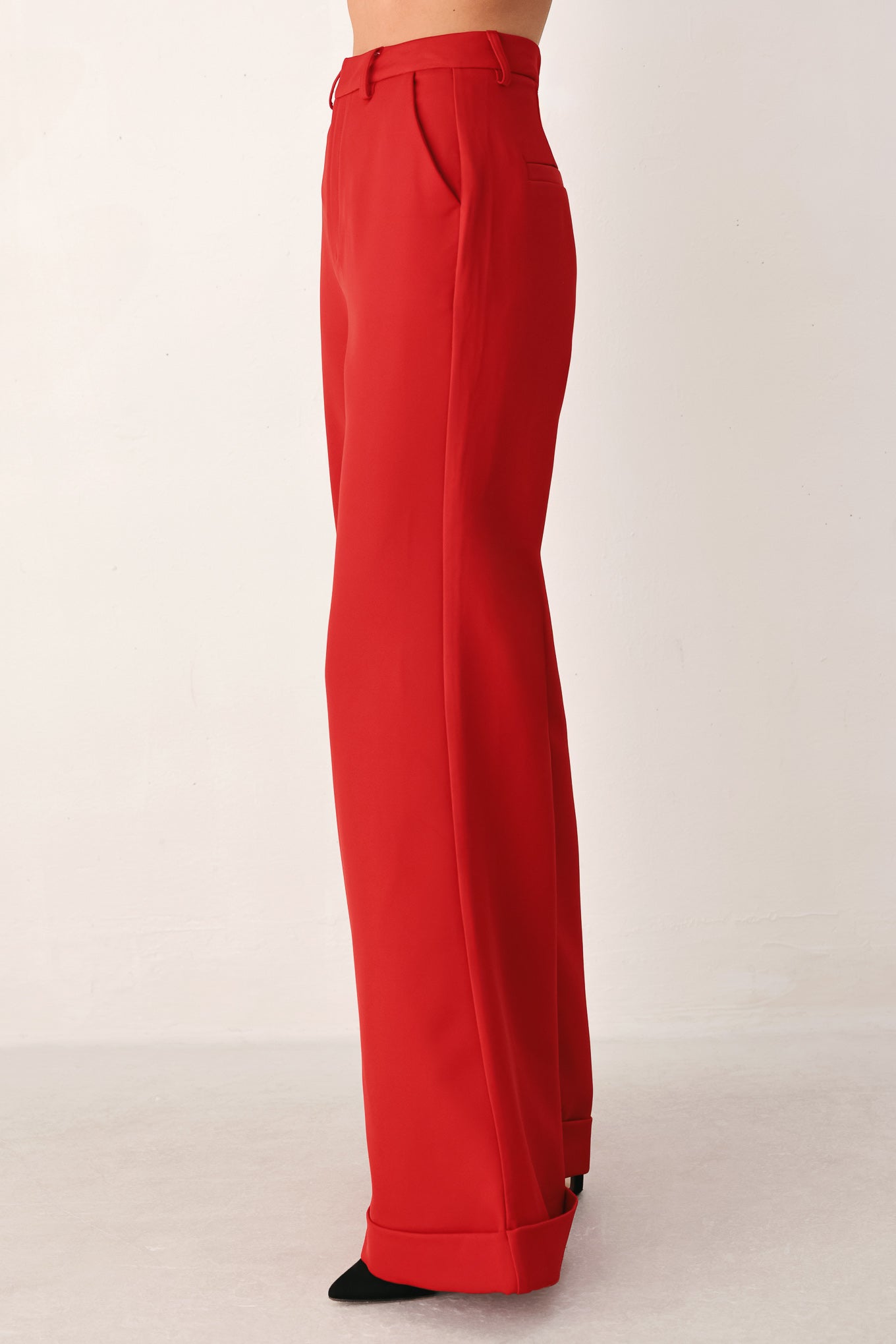 Red wide-leg cropped pants with rolled cuffs, shown on a model | FREEMARKET