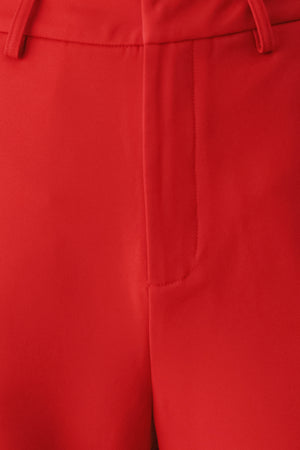 Red wide-leg cropped pants with rolled cuffs, shown on a model | FREEMARKET