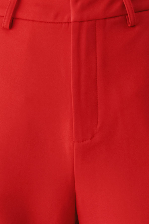 Red wide-leg cropped pants with rolled cuffs, shown on a model | FREEMARKET