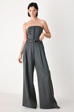 A model wearing a dark gray strapless wide-leg jumpsuit with a matching belt | FREEMARKET