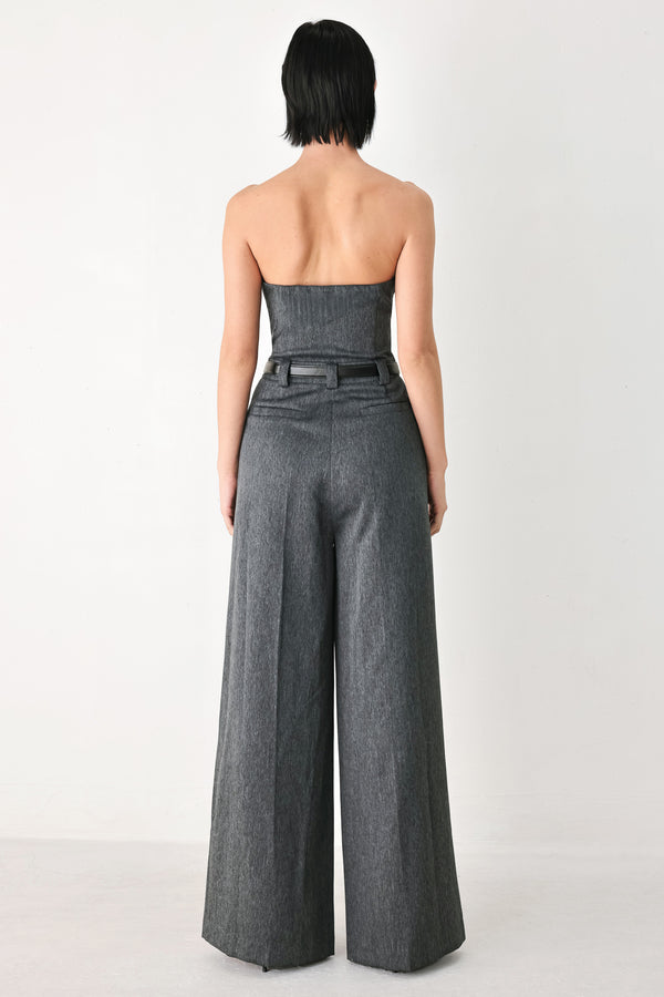 A model wearing a dark gray strapless wide-leg jumpsuit with a matching belt | FREEMARKET