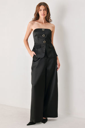 Black wide-leg trousers with a satin-like sheen, shown on a model | FREEMARKET