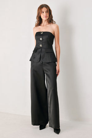 Black wide-leg trousers with a satin-like sheen, shown on a model | FREEMARKET