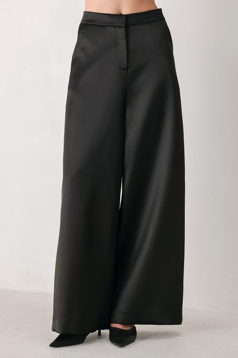 Burgundy wide-leg trousers with a satin-like sheen, shown on a model | FREEMARKET