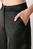 Black wide-leg trousers with a satin-like sheen, shown on a model | FREEMARKET