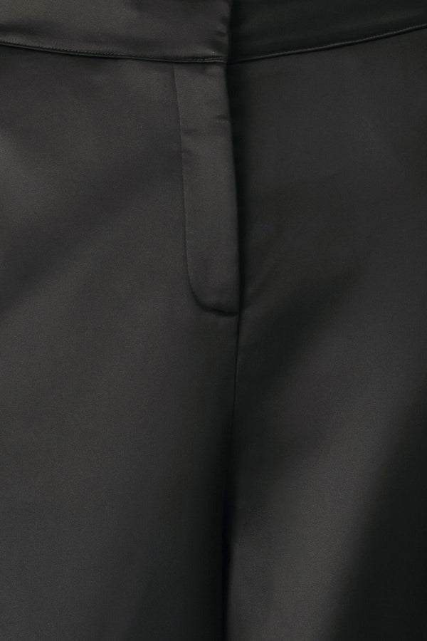 Black wide-leg trousers with a satin-like sheen, shown on a model | FREEMARKET