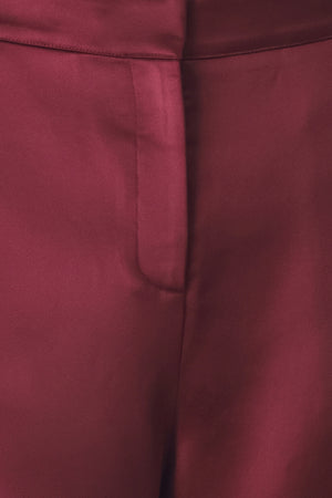 Burgundy wide-leg trousers with a satin-like sheen, shown on a model | FREEMARKET