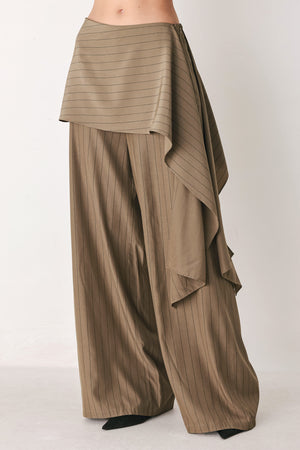 Woman wearing wide leg high waisted pants with a skirt draping over | FREEMARKET