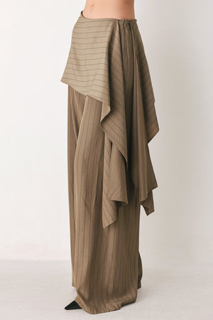 Woman wearing wide leg high waisted pants with a skirt draping over | FREEMARKET