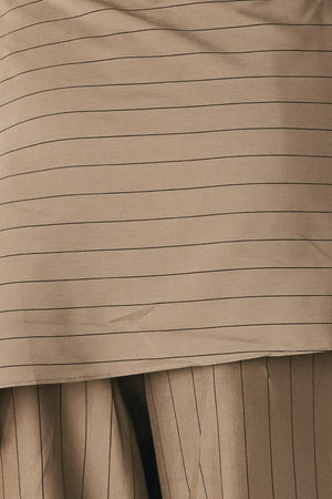Woman wearing wide leg high waisted pants with a skirt draping over | FREEMARKET