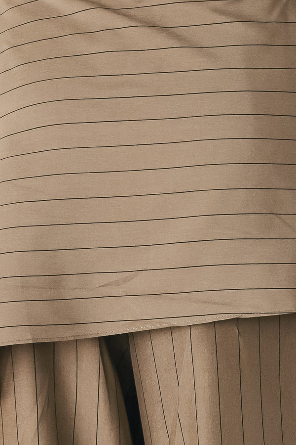 Woman wearing wide leg high waisted pants with a skirt draping over | FREEMARKET