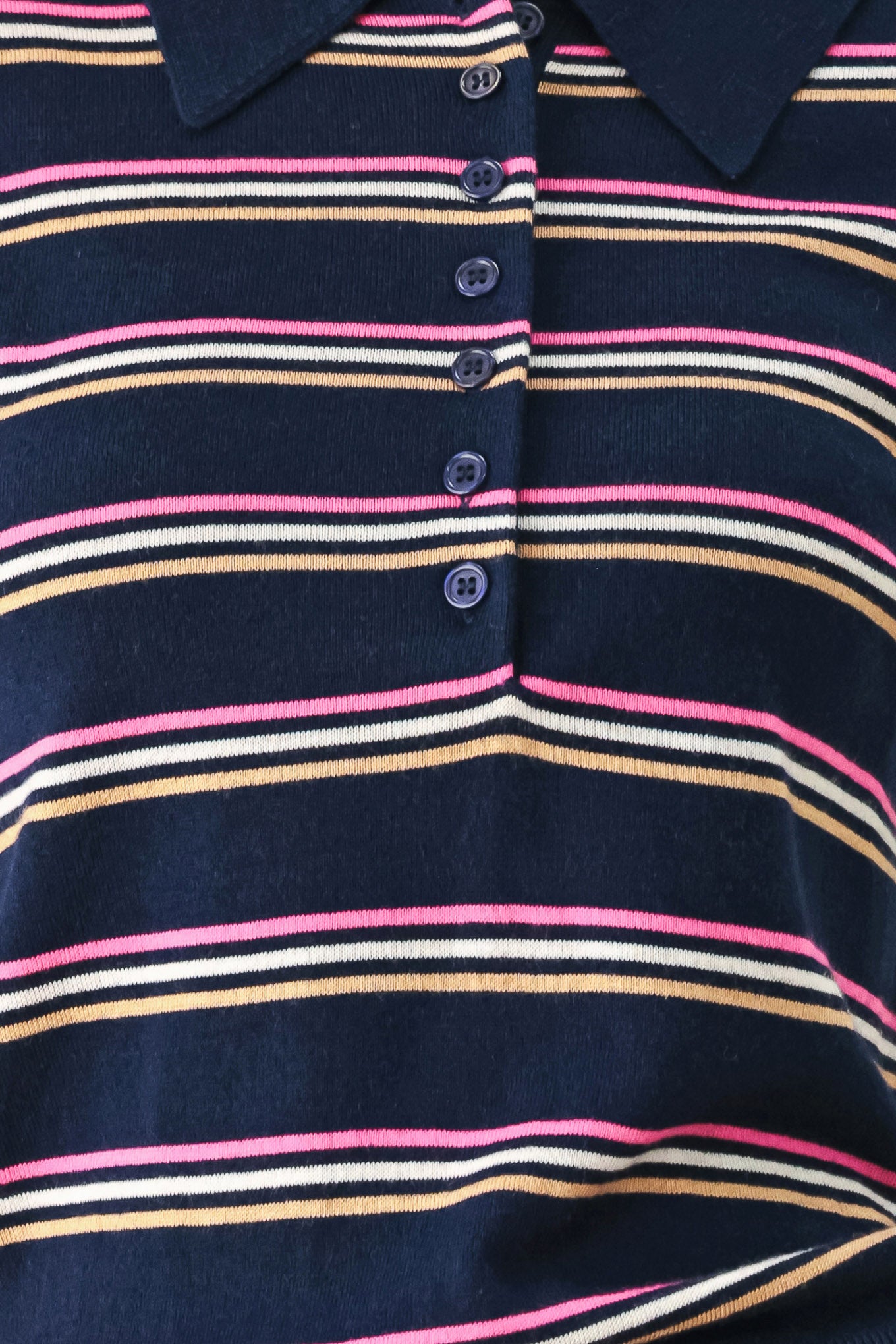 A woman wearing a navy blue short-sleeve polo shirt with thin horizontal stripes in pink, yellow, and white | FREEMARKET