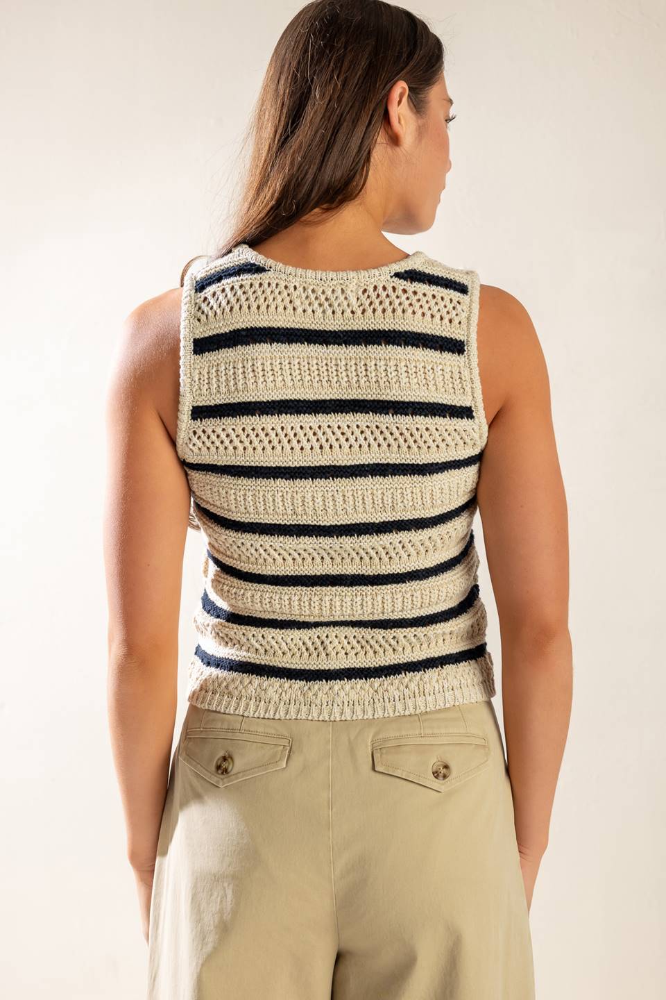 A sleeveless striped sweater knit vest with button down.