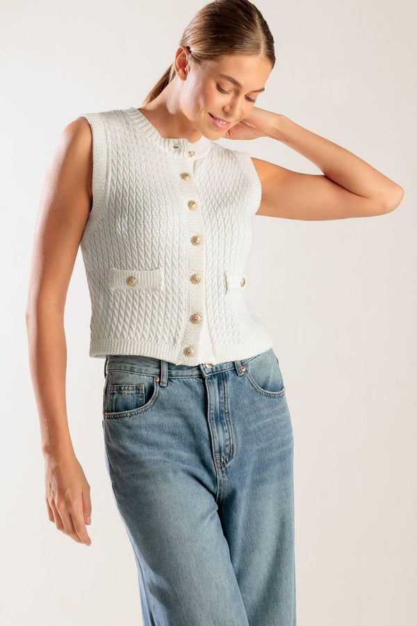 A white, sleeveless, sweater knit vest featuring round neckline and button down closure.