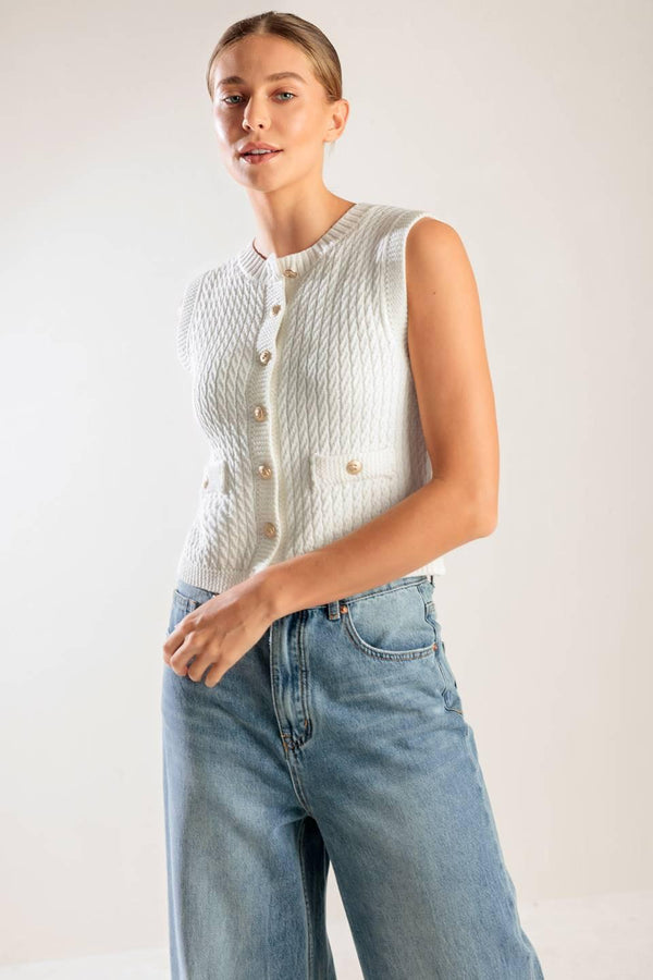 A white, sleeveless, sweater knit vest featuring round neckline and button down closure.