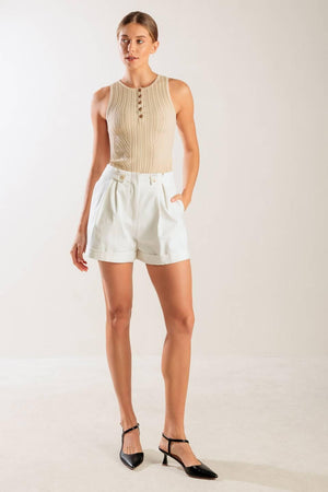 A sleeveless, sweater knit tank top with front button down