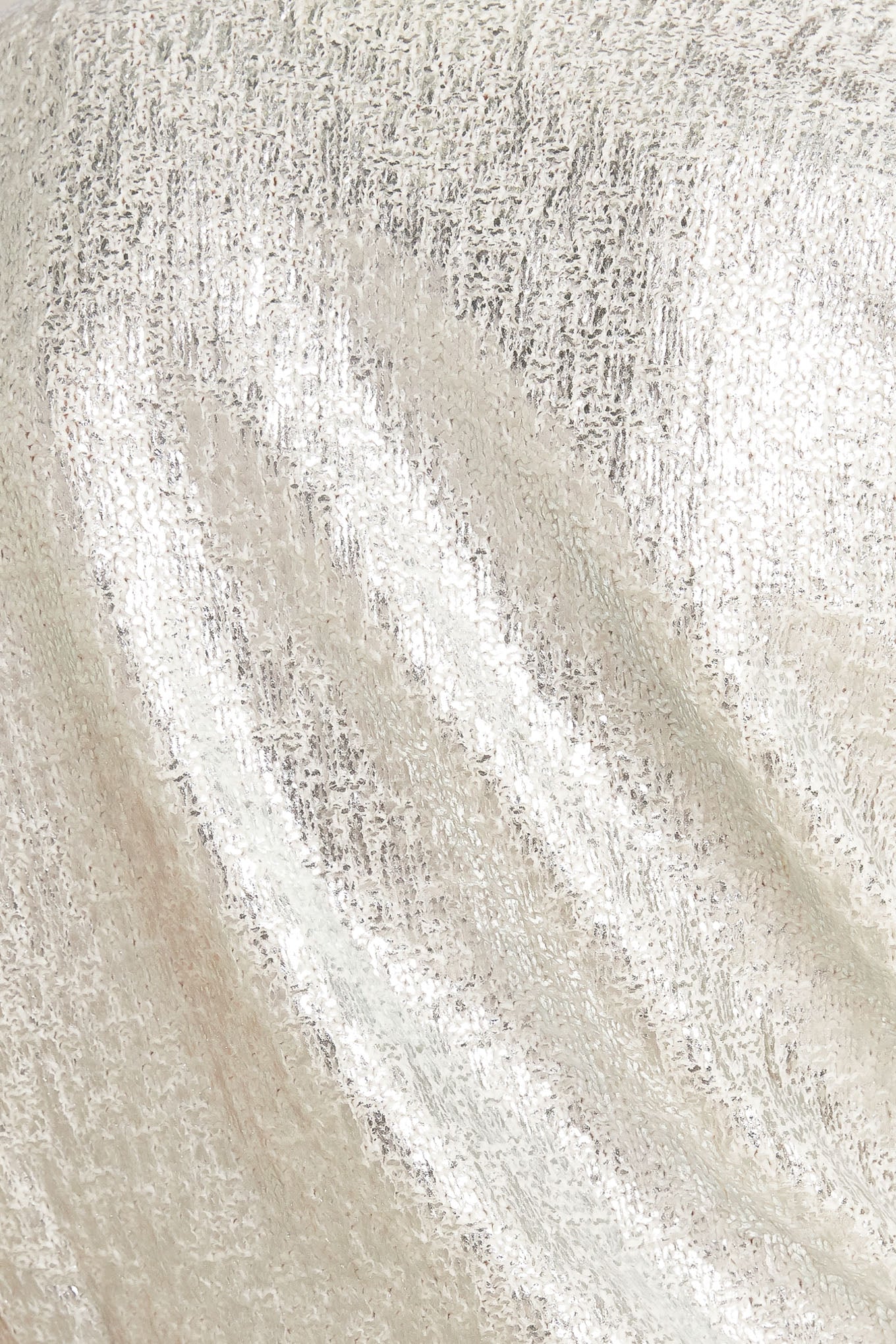 A foiled sweater knit top featuring crew neckline and short sleeve
