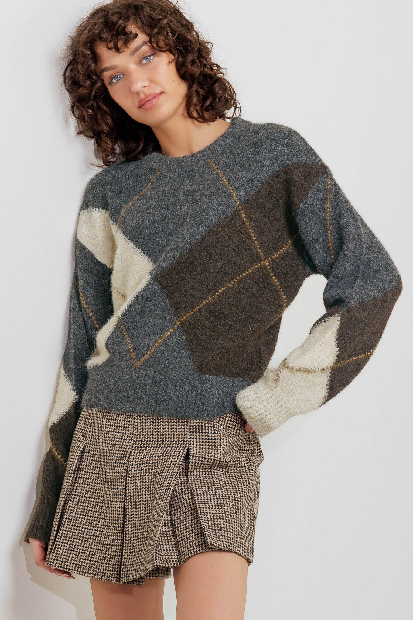 A pullover sweater knit top with round neckline and long sleeve