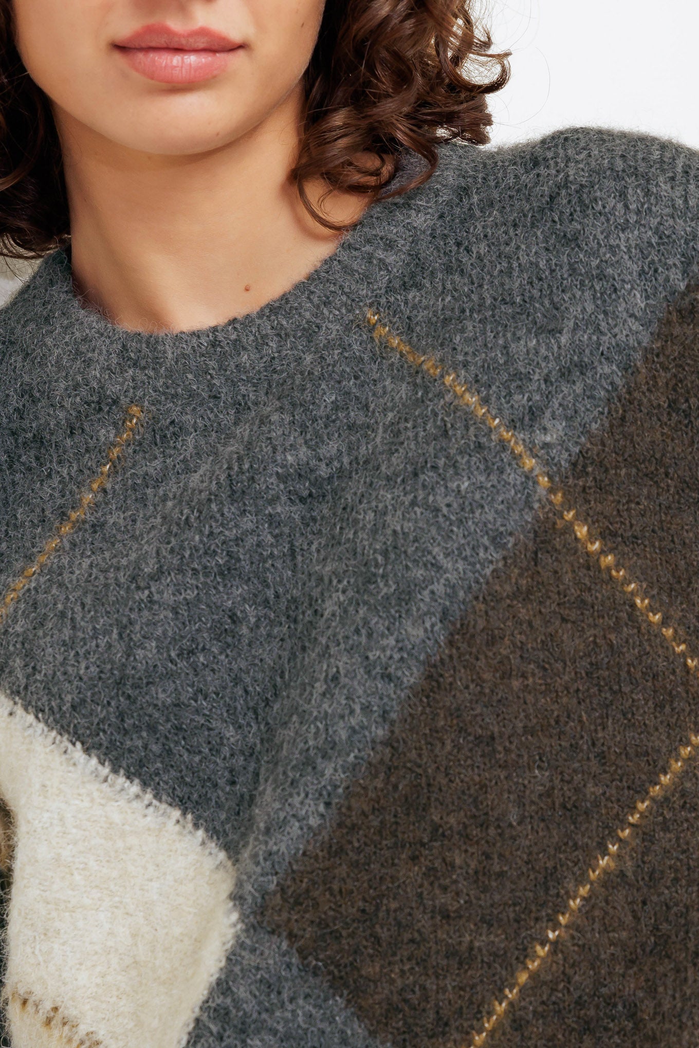A pullover sweater knit top with round neckline and long sleeve