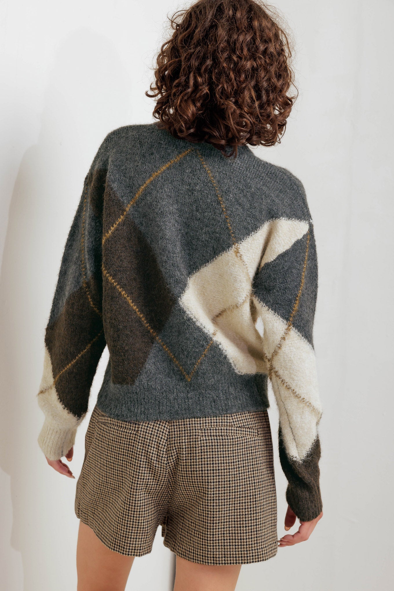A pullover sweater knit top with round neckline and long sleeve