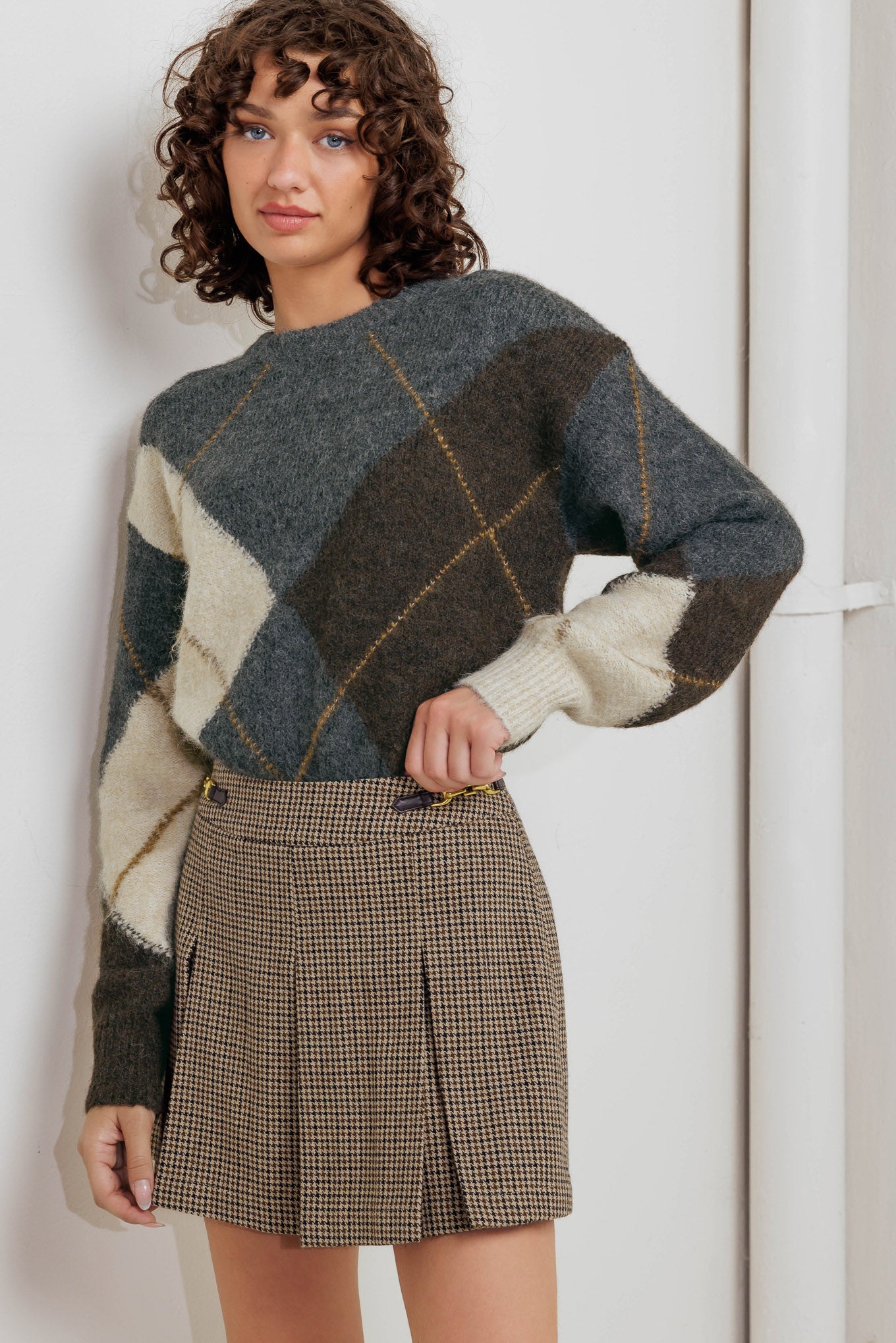 A pullover sweater knit top with round neckline and long sleeve