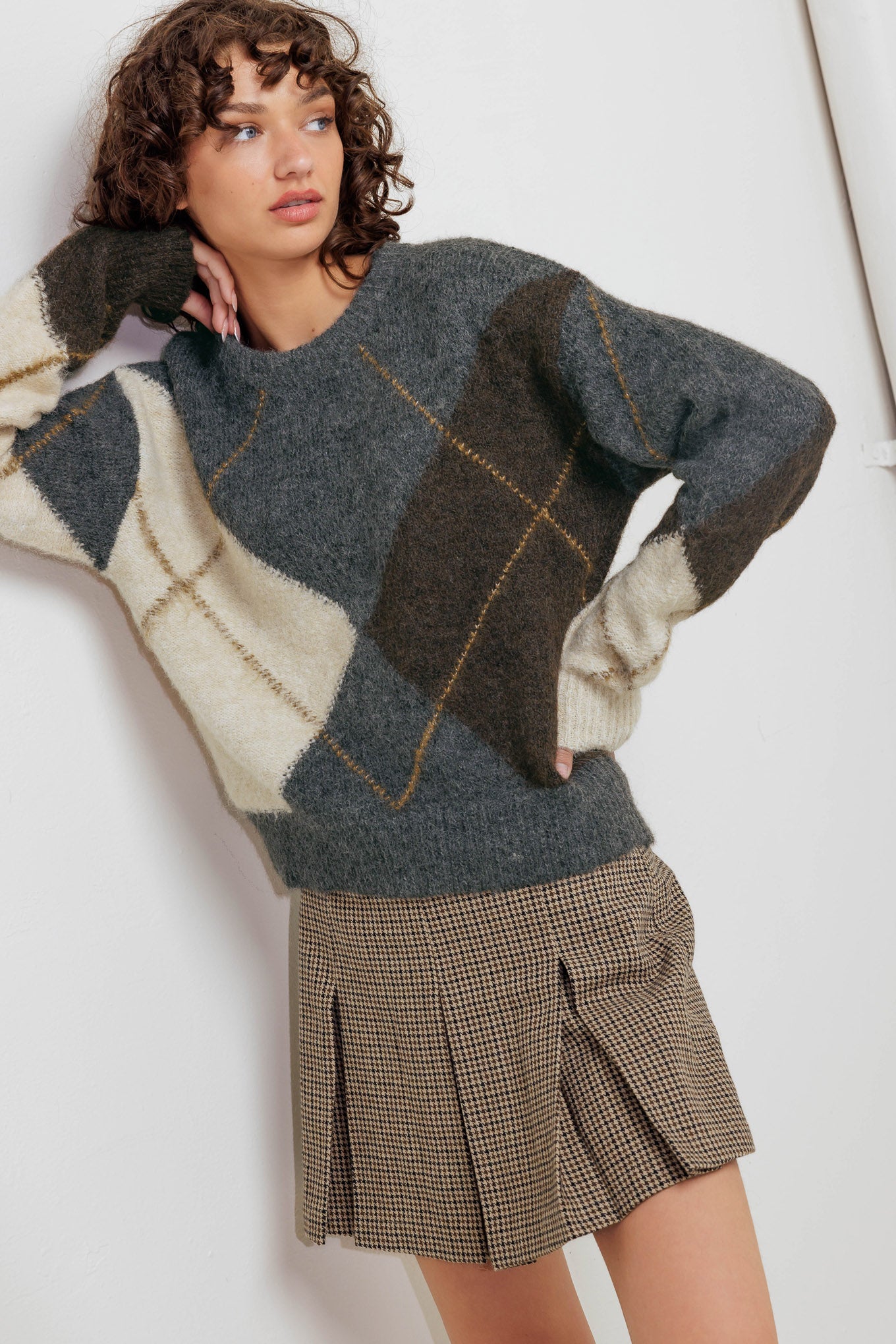 A pullover sweater knit top with round neckline and long sleeve