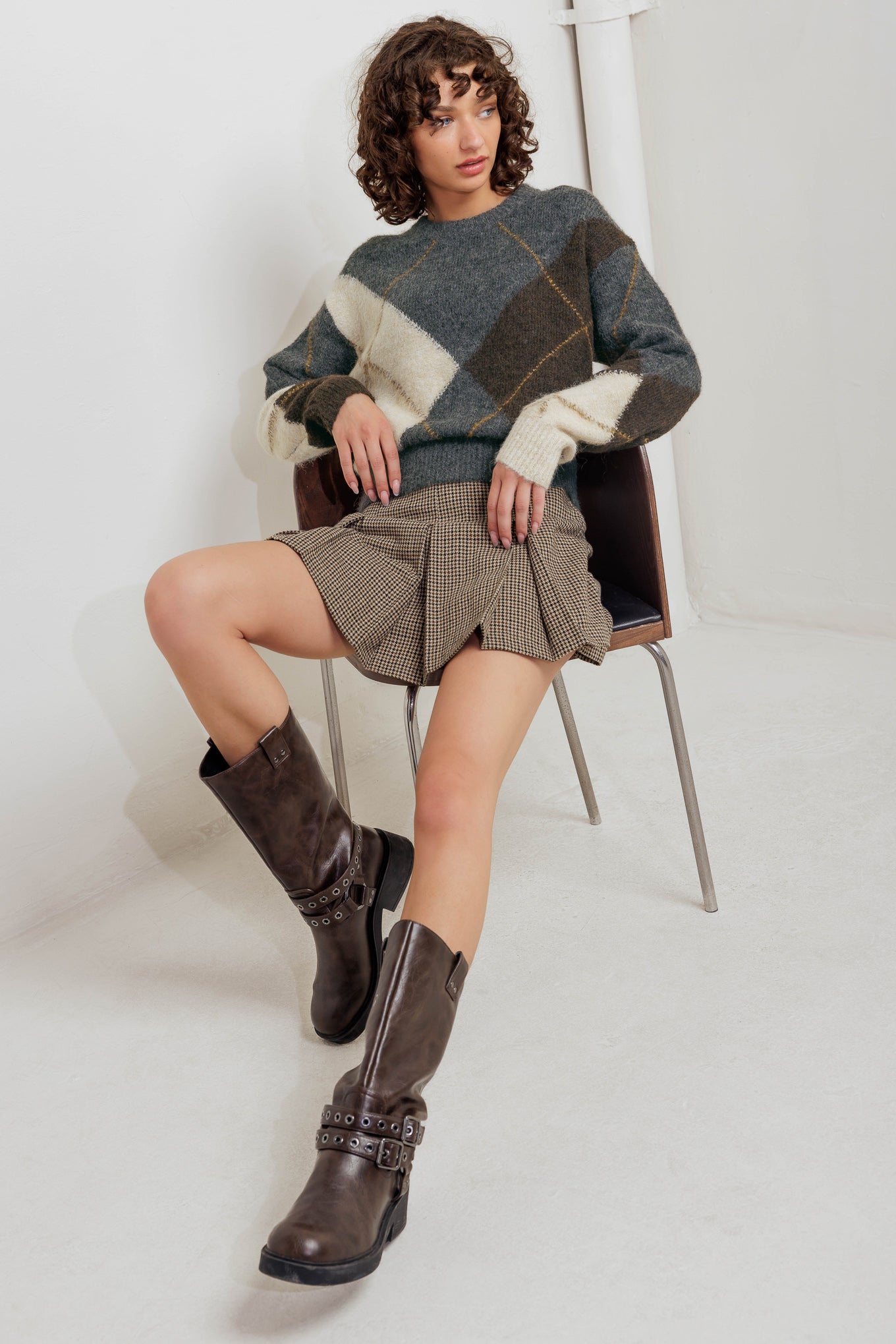 A pullover sweater knit top with round neckline and long sleeve
