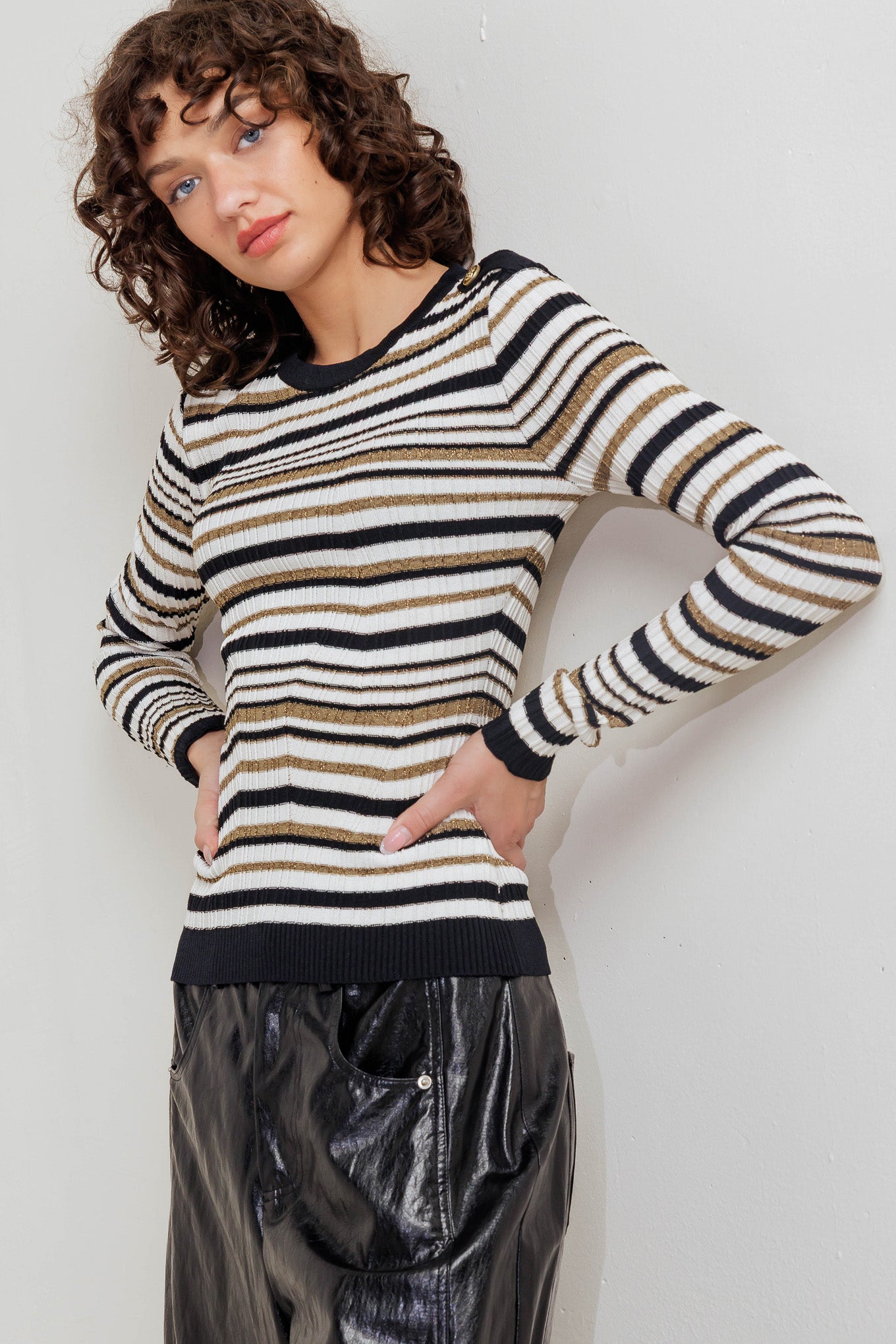 A sweater knit top with round neckline and long sleeve