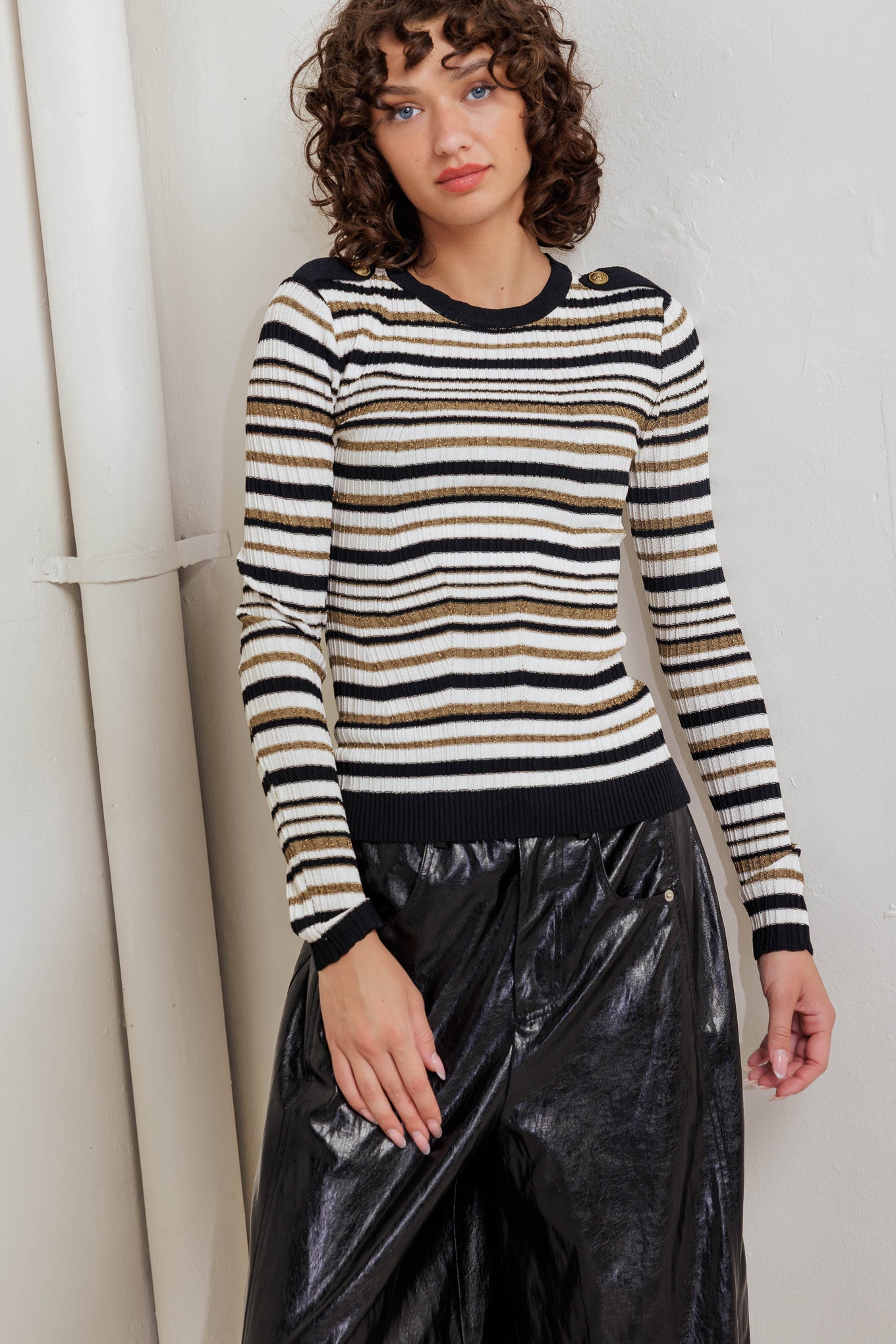 A sweater knit top with round neckline and long sleeve