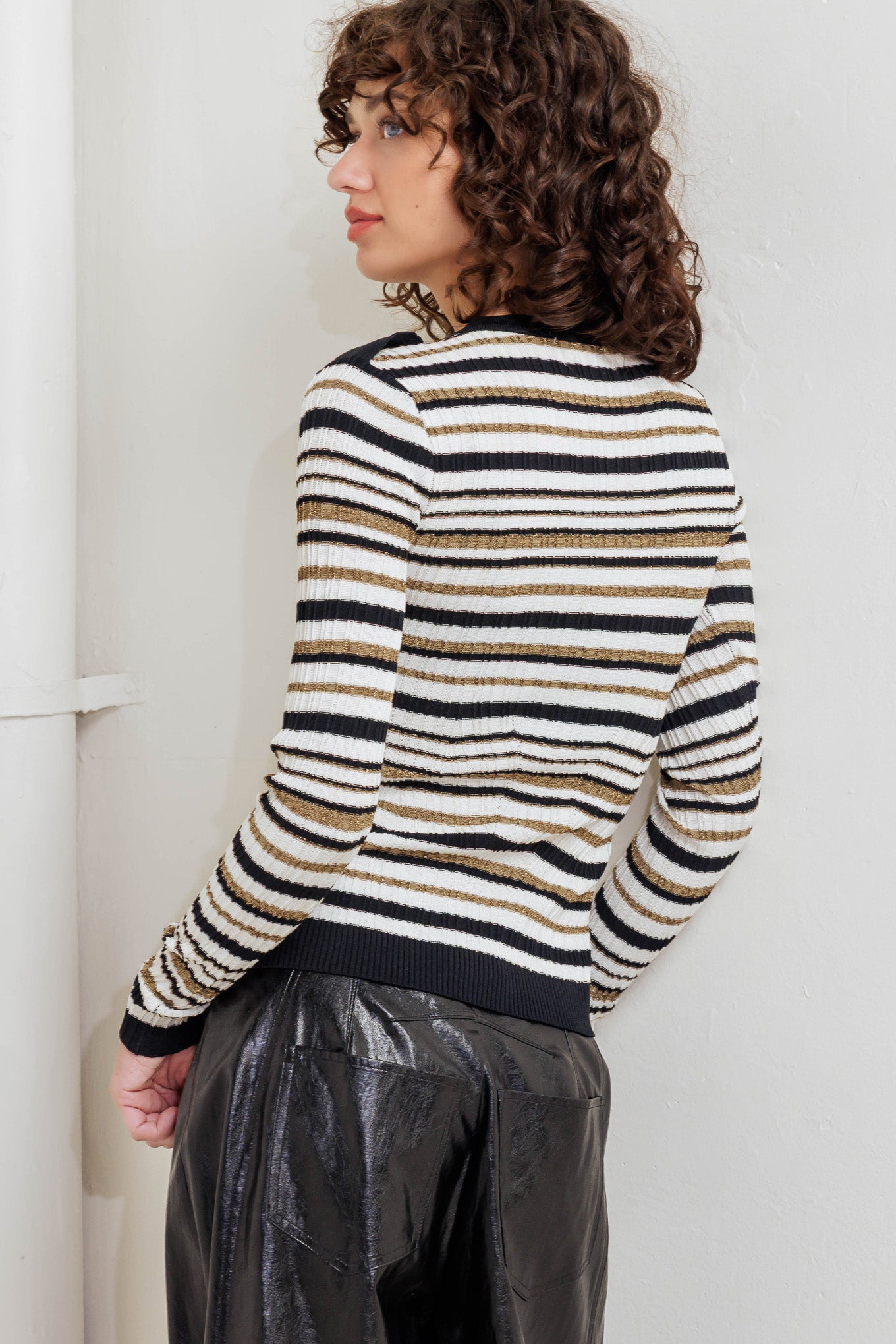 A sweater knit top with round neckline and long sleeve