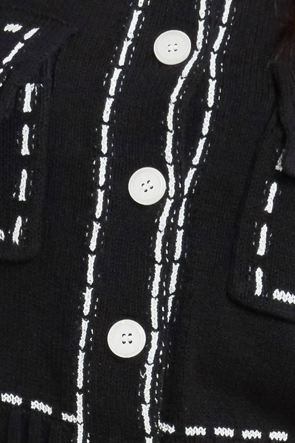 A sweater knit top featuring round neckline, button down, long sleeve and stitch edge detail