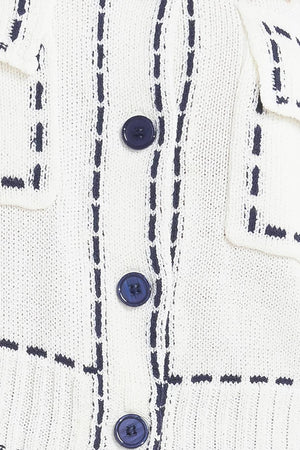 A sweater knit top featuring round neckline, button down, long sleeve and stitch edge detail