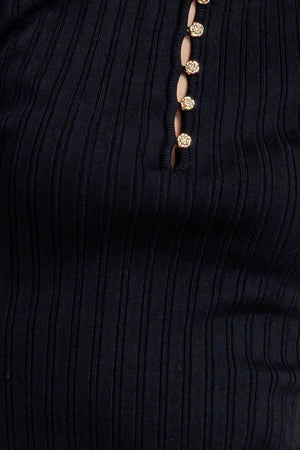 A ribbed sweater knit top featuring round neckline, front button closure and short sleeve