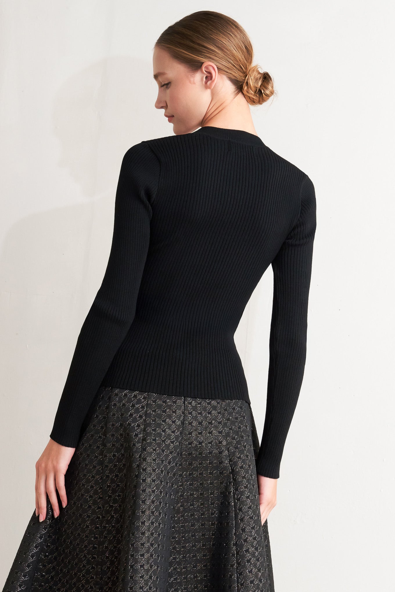 A sweater knit top with button detail
