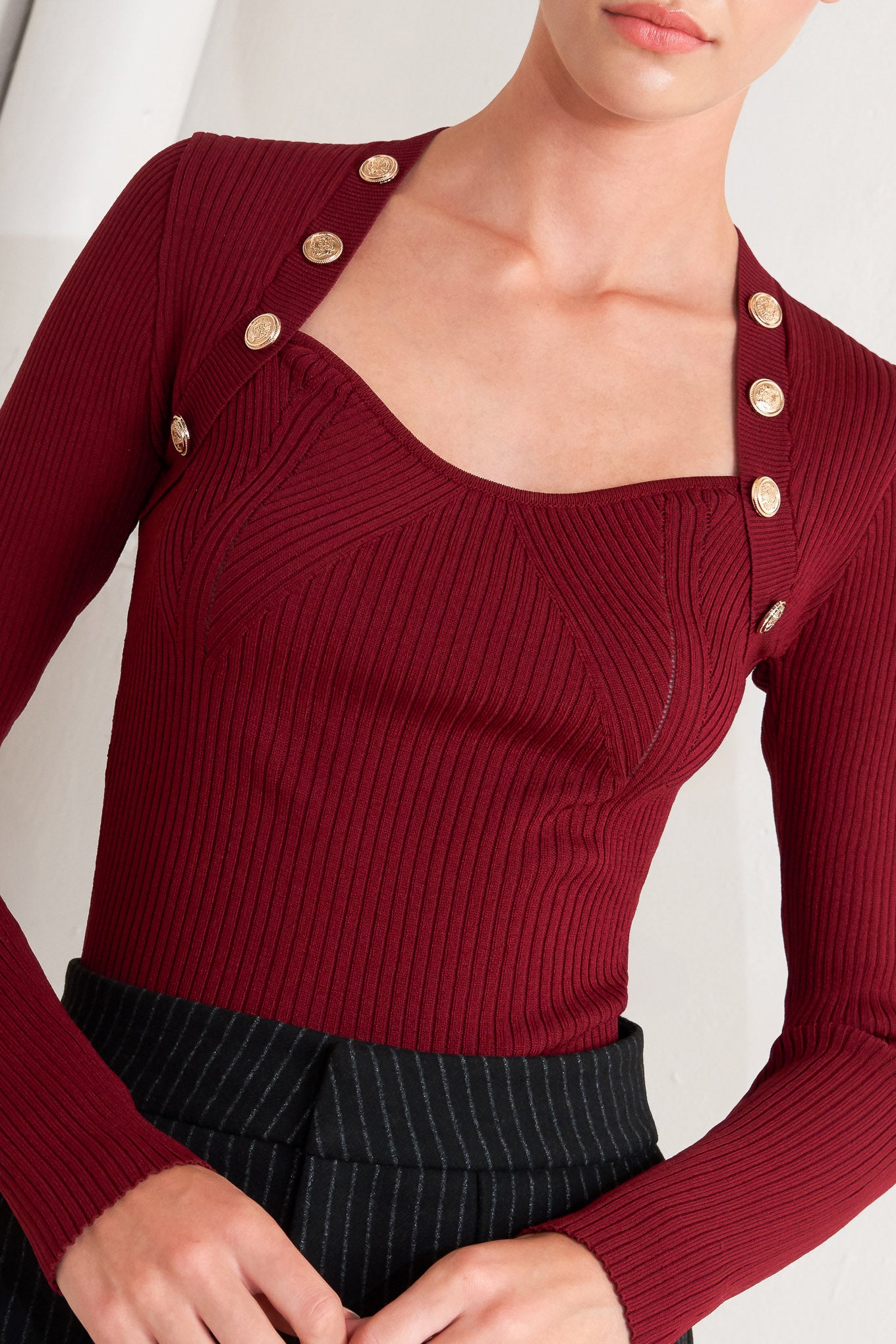 A sweater knit top with button detail