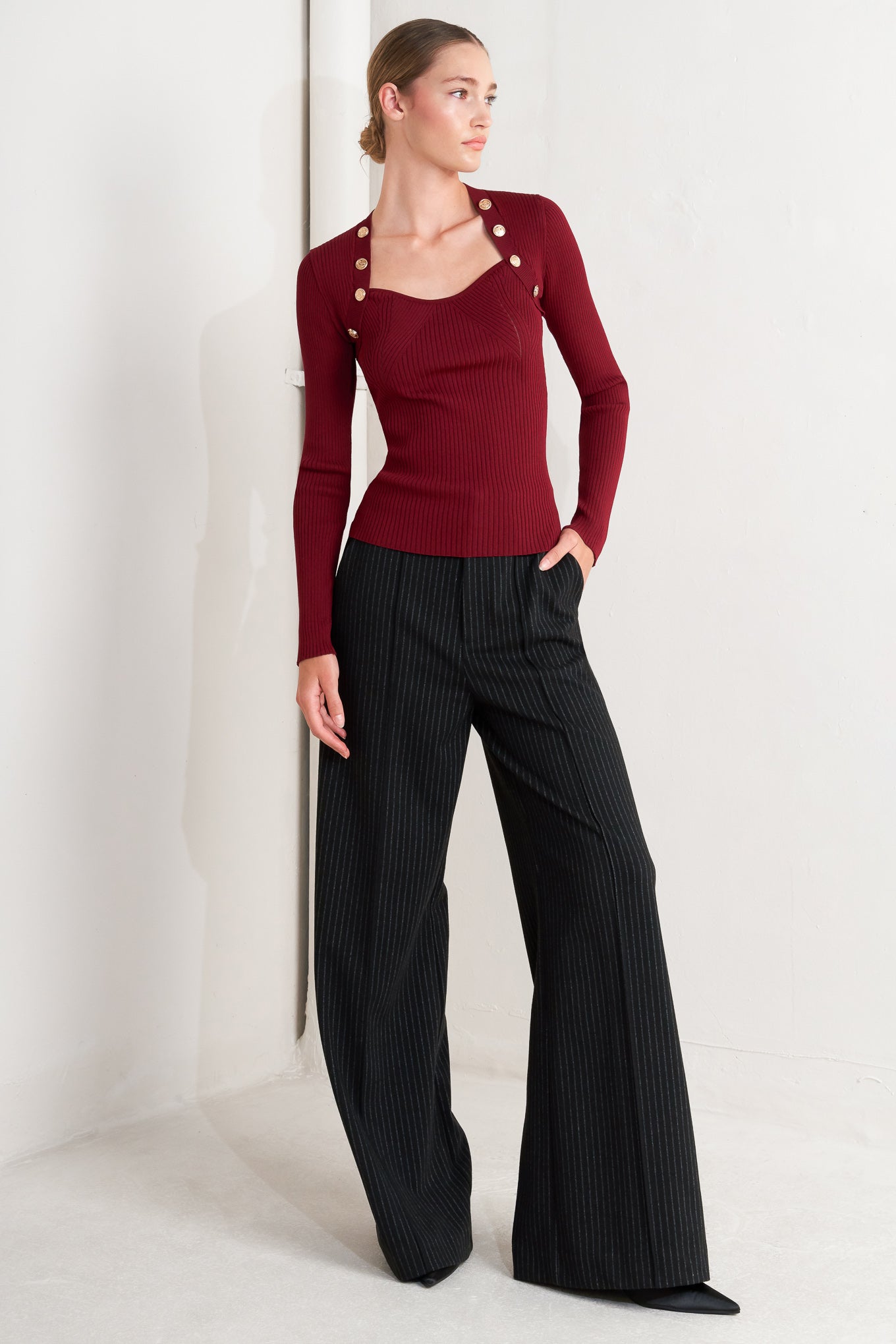 A sweater knit top with button detail