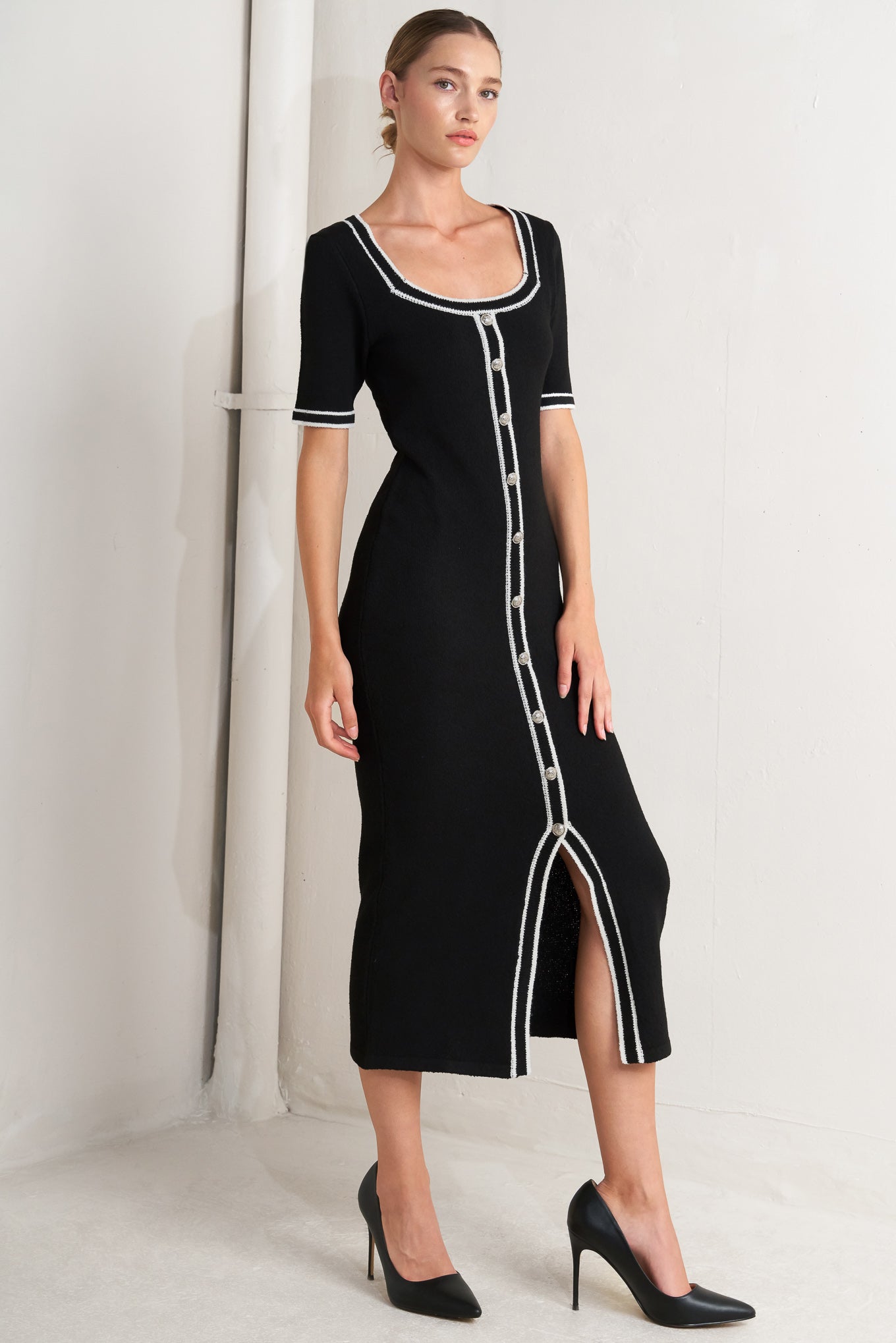 A sweater knit midi dress featuring square neckline, short sleeve and front button detail