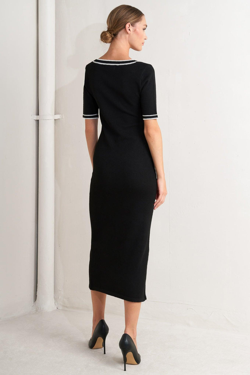 A sweater knit midi dress featuring square neckline, short sleeve and front button detail